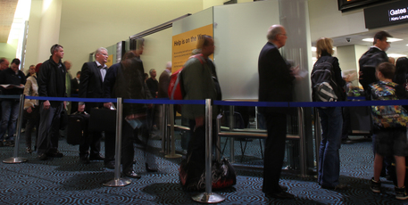 A time lapse photograph at Auckland Domestic Airport shows how slow the large crowd of morning air travels queues for before being screened by security. Photo / Greg Bowker.