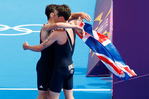 Gold medalist Alistair Brownlee hugs his brother, Jonathan, who won bronze in London. Photo / Mark Mitchell