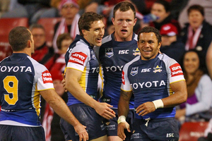 Matthew Bowen of the Cowboys is congratulated after scoring against the Dragons. Photo / Getty Images