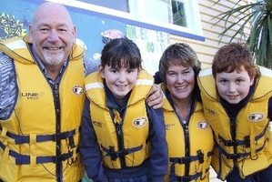 South New Brighton School Principal John Bockett, Rachel Anderson, Wendy McLintock and Jack Anderson sporting the lifejackets they will wear if they are hit by a tsunami. Photo / Shelley Robinson