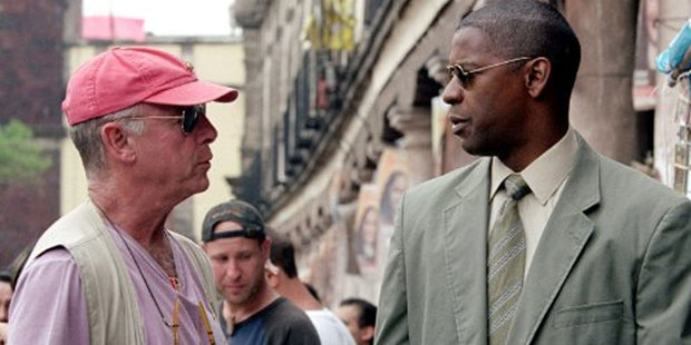 Tony Scott talks to actor Denzel Washington while filming his 2004 movie Man on Fire. Photo / 20th Century Fox