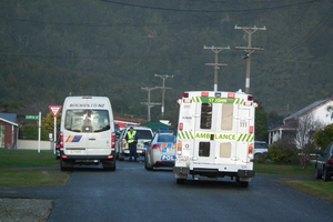 The scene in Hector today after a school bus (left) struck and killed a 5-year-old boy. Photo / Keira Stephenson