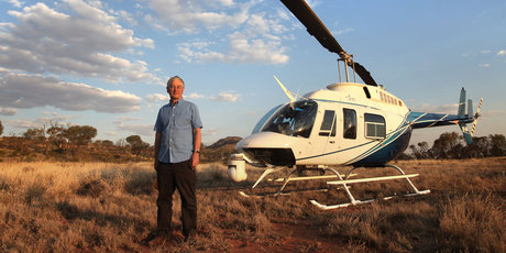 Australian businessman Dick Smith, seen here with his LongRanger helicopter in the Australian outback, is on a mission to change big business. Photo / Nick Graalman.
