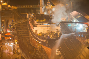 More than a dozen fire trucks were battling a major blaze on board a ship in Lyttelton overnight. Photo / Aaron Campbell