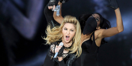 Madonna says her use of fake guns during concerts is just a metaphor. Photo / AP