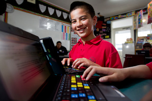 The trust provides cheap computers and internet for children such as Calvin Smith in low-decile schools in Tamaki/Glen Innes. Photo / Sarah Ivey