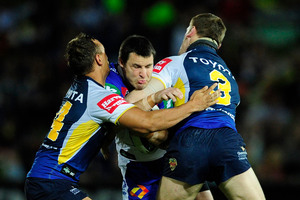 Newcastle's James McManus is sandwiched.
Photo / Getty Images