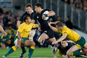 All Black Dan Carter pushes through the defense during the All Blacks v Australia match. Photo / Sarah Ivey