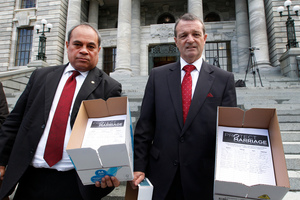 Labour MPs Su'a William Sio, left, and Ross Robertson with the petition opposing gay marriage. Photo / Mark Mitchell