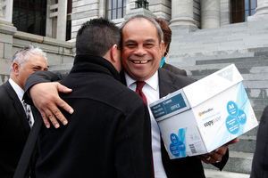 Labour MP Su'a William Sio gets a hug from Family First NZ member Steve McRobie after receiving the petition. Photo / Mark Mitchell