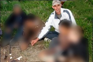 Convicted child
sex abuser and
former deputy
school principal
James Parker
toasts
marshmallows
at a camp with
pupils. Photo / Supplied