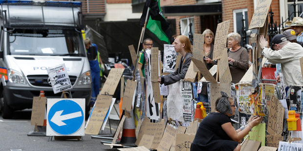 Supporters of WikiLeaks founder Julian Assange outside the Ecuadorian Embassy in London. Photo / AP