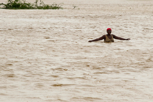 A woman wades through flood waters in Port-au-Prince, Haiti. Photo / AP