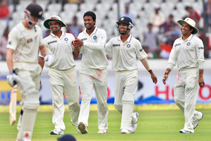 India's bowler Pragyan Ojha, centre, celebrates the dismissal of NZ's batsman Kane Williamson. Photo / AP
