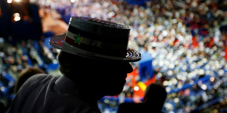 North Carolina delegate Steve Malay dons his hat at the Republican National Convention. Photo / AP