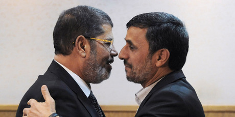 Iranian President Mahmoud Ahmadinejad (right) and his Egyptian counterpart, Mohammed Morsi. Photo / AP