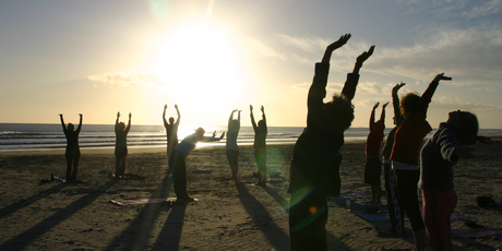 A Waihi beach class salutes the sun on New Year's Day. Photo / Bay of Plenty Times