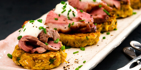 Pomegranate glazed duck on cauliflower fritters. Photo / Babiche Martens
