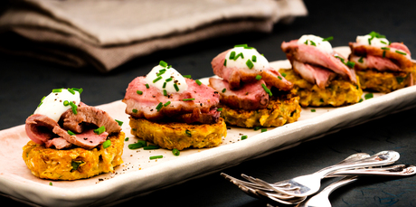 Pomegranate glazed duck on cauliflower fritters. Photo / Babiche Martens