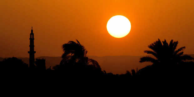 The sun sets over the Nile. Photo / Alan Gibson