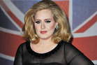 Adele says she is definitely not married, and is tired of the rumours. Photo / Getty