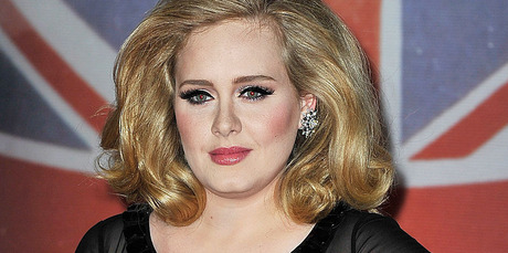 Adele says she is definitely not married, and is tired of the rumours. Photo / Getty