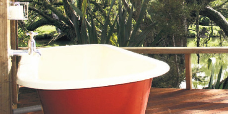 Dare to bare all in the delightful bath on the deck. Photo / Supplied