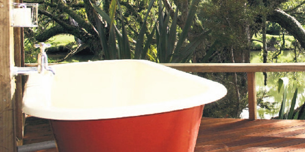 Dare to bare all in the delightful bath on the deck. Photo / Supplied