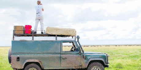 Debbie Simpson checks out herds migrating across the Serengeti. Photo / Peter Simpson