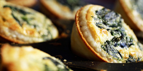 Spinach and parmesan quiches are the perfect bite-sized treat. Photo / Michael Craig