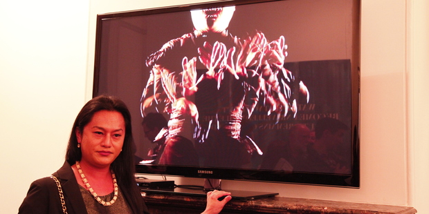 Auckland artist Shigeyuki Kihara stands in front of her video tribute, titled Galu Afi: Wave of Fire. Picture / Tanya Ruka