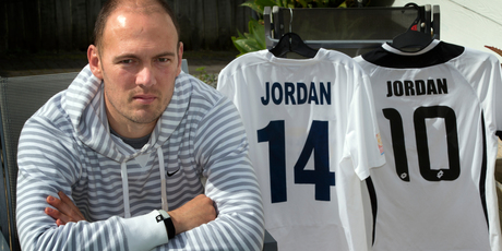 Cancer fighter Keryn Jordan with his old Auckland City playing jersey (left) and son Liam's on the right. Photo / Brett Phibbs