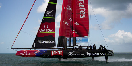 Team New Zealand's hydrofoil-equipped AC72 catamaran flies over the Waitemata Harbour yesterday afternoon with both hulls clear of the water. Photo / Sarah Ivey