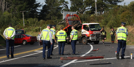 Police at the scene of a head-on collision on SH2 near Te Mete Rd. Photo / Joel Ford