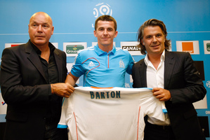 A private jet took Joey Barton (centre) from Fleetwood Town to a new life in Marseilles. Photo / AP