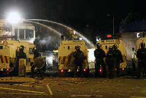Police use a water cannon on loyalist rioters in North Belfast, Northern Ireland. Photo / AP