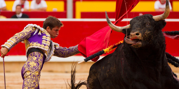 Spanish bullfighter Julian Lopez 'El Juli' performs with a Victoriano del Rio ranch fighting bull during a bullfight during the San Fermin festival, in Pamplona, Spain. Photo / AP