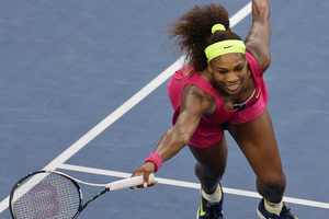 Serena Williams returns a shot to Italy's Sara Errani. Photo / Mike Groll