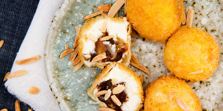 Goat's cheese fritters stuffed with dates and almonds. Photo / Babiche Martens