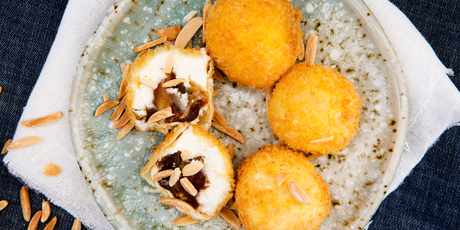 Goat's cheese fritters stuffed with dates and almonds. Photo / Babiche Martens