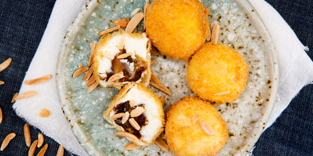 Goat's cheese fritters stuffed with dates and almonds. Photo / Babiche Martens