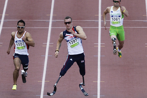 Marathon world record holder Richard Whitehead continued to push the boundaries of human achievement by racing to Paralympic gold in a new world record over 200 metres. Photo / Getty Images.