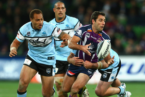 Cameron Smith of the Storm passes the ball during the match between the Melbourne Storm and the Cronulla Sharks. Photo / Getty Images