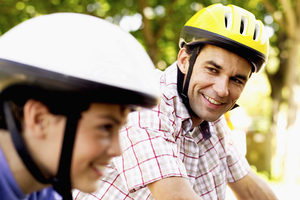 Dads are advised to set a good example for their kids by practising the healthy lifestyle they preach about. Photo / Thinkstock