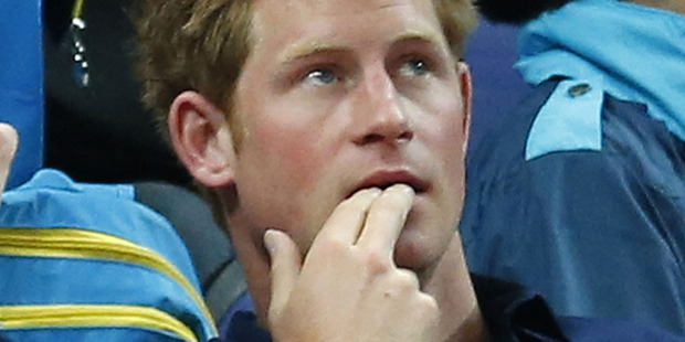 A woman who claims she made out with Prince Harry during his Vegas shenanigans wasn't there, claims a royal source. Photo / AP