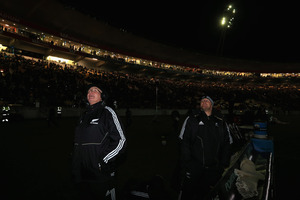 All Black forwards coach Mike Cron and Ben Franks wait for the lights to come back on after a powercut. Photo / Getty Images