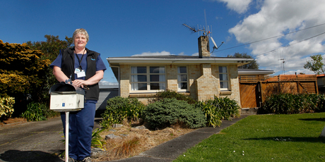 Nurse Anne-Marie Wilsem at the 'no-reserve' house she bought yesterday at auction. Photo / Christine Cornege