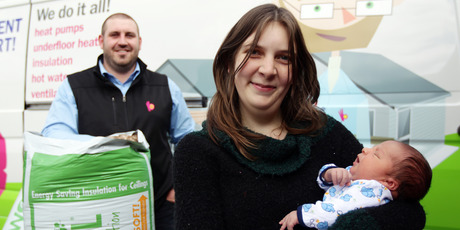 Michaela Thrush and baby Elijah, in front of Right House's Sam Light, should have a warmer home. Photo / Doug Sherring