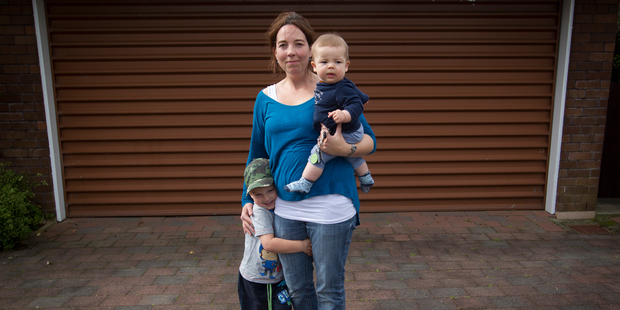 Nicola Drayton with Sam, 3, and 6-month-old Charlie on her driveway where their car was stolen. Photo / Richard Robinson