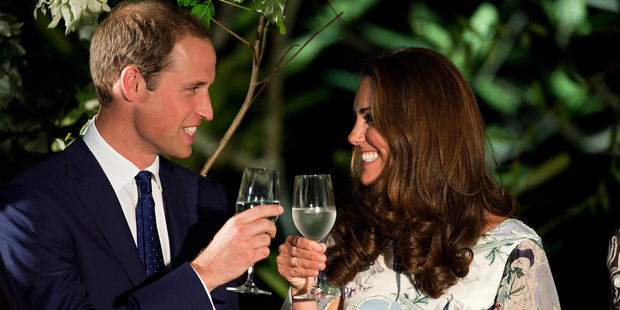 Britain's Prince William and his wife Catherine, the Duchess of Cambridge, make a toast in the honour of Queen Elizabeth's Diamond Jubilee at a British Gala reception in Singapore. Photo / AP